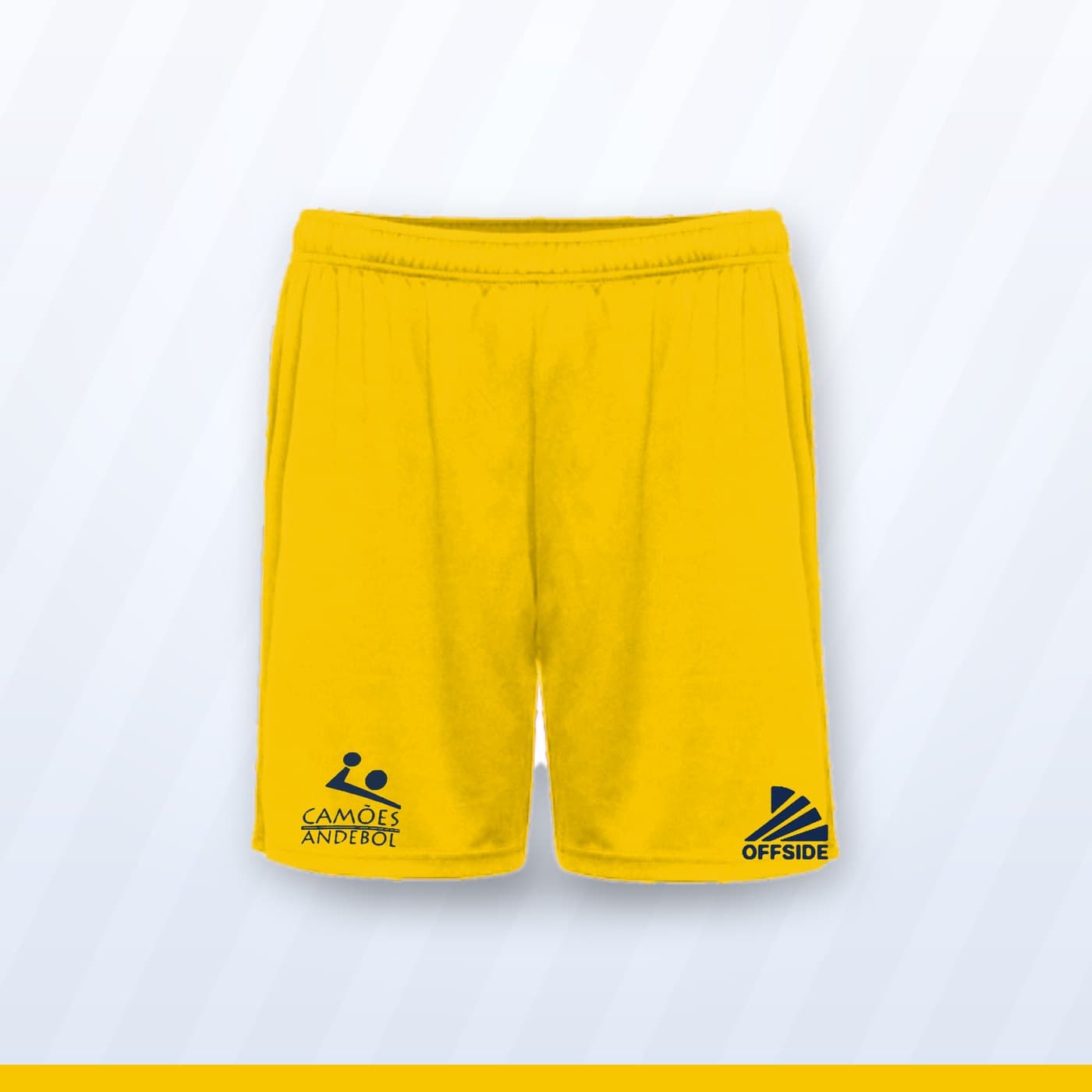 Calções de treino amarelos com o símbolo do Camões Andebol